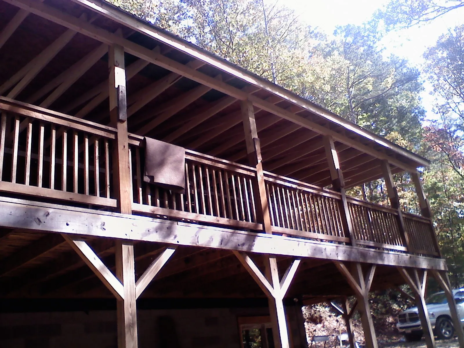 Timber framing under a new elevated porch and deck — Roof Leak Repair in Rowe by Roofing Brothers